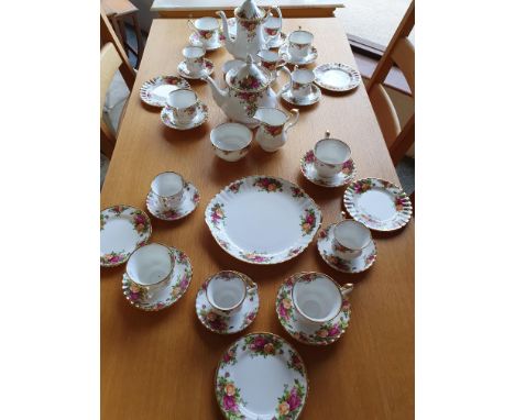 A Royal Albert Country Roses tea and coffee service for six place settings, comprising tea pot, sugar bowl, milk jug, coffee 