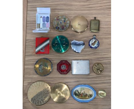 A novelty compact in the form of a packet of silk cut cigarettes and other compacts