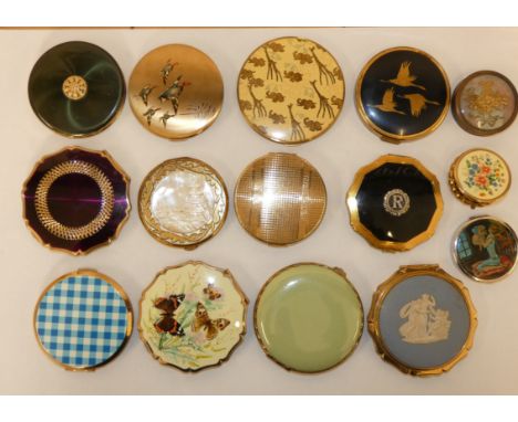 A Stratton compact, unused, a compact with applied mother of pearl carved panel and other compacts