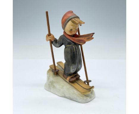 The skier waits at the top of the mountain, gazes down at the steep descent, and is eager to begin his run. Crafted from matt