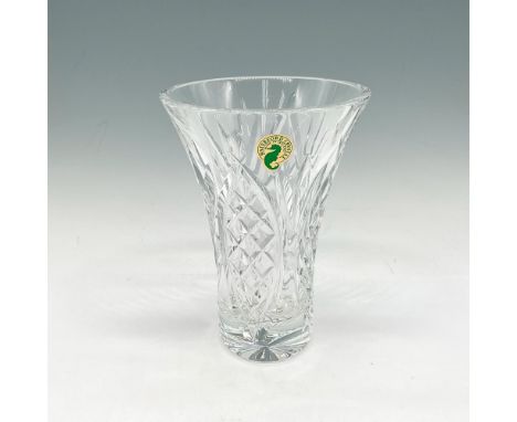 Elegant, tapered crystal vase is beautifully crafted with intricate cut patterns that reflect light and illuminate your home.