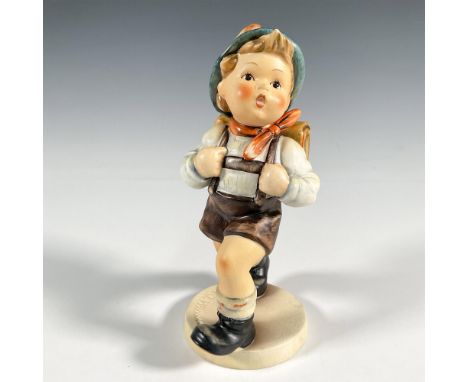 A hand-painted figurine depicts a boy dressed in school attire engaging in the daily routine of a brisk hike to the school gr