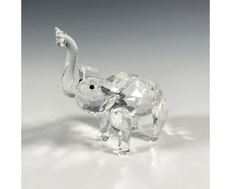 Multifaceted clear crystal elephant with black eyes and raised trunk. Shannon Crystal sticker. Issued: 20th centuryDimensions
