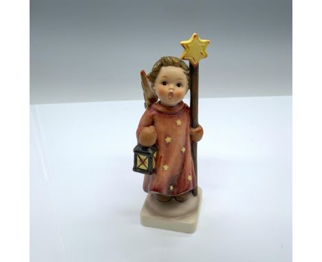 Hand-painted figurine depicting a singing angel with a staff and lantern. Goebel backstamp on the bottom. Issued: 1957Dimensi