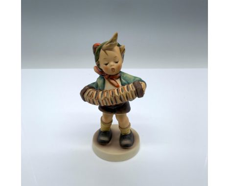 Hand-painted figurine depicting a boy playing music on an accordion. Goebel backstamp on the bottom. Dimensions: 2.5"L x 2.25