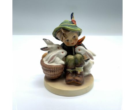 Hand-painted figurine depicting a boy with bunny rabbits. Goebel backstamp on the bottom. Artist: Reinhold UngerDimensions: 3