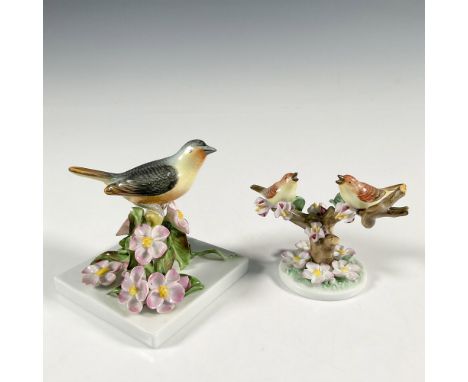 Introducing a delightful pair of Herend figurines, meticulously hand-painted to depict birds perched on cherry blossom trees.