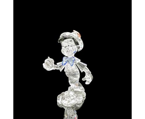 Adored children's character is created in clear crystal with jet crystal inset eyes and hair, blue crystal bow tie and pink c