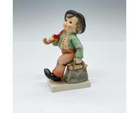 Hand-painted porcelain figurine depicting a young traveler setting out on a new adventure with a spring in his step, a red um