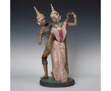 Intricately designed, gres finished figures are dressed in traditional clothing and colored in browns, lavender, green and gr