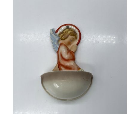 Hand-painted porcelain wall pocket featuring a charming angel adorned with flowers. Goebel TMK6. Issued: 1979-1990Dimensions: