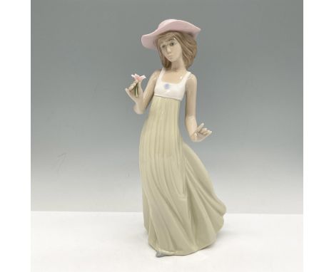 Lovely young lady wearing pink hat and long dress, holding a flower. Nao by Lladro backstamp. 1158. This item has its origina