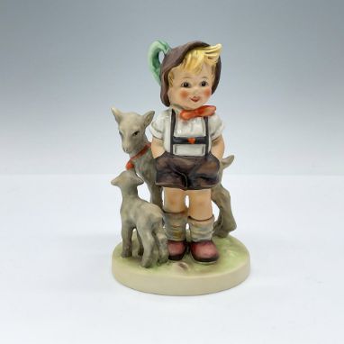 Hand-painted figurine depicting a boy with his goats. Goebel TMK5. Issued: 1972-1979Dimensions: 3.5"L x 3"W x 5.25"HManufactu