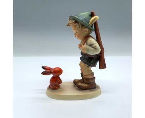 Hand-painted figurine depicting a boy with a rifle slung over his shoulder looking at a bunny rabbit. Goebel backstamp on the