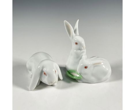 Glossy hand painted white rabbits with the Herend hallmarks on the bottoms. The first measures approximately 3.25"L x 2"W x 1