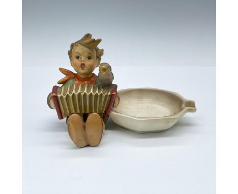 Also known as Let's Sing, this matte porcelain figural ashtray features a boy with an accordion and a singing bird. Goebel TM