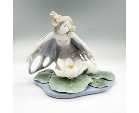 Glazed porcelain figure of a fairy with expanded wings kneeling over water lilies. Lladro backstamp. This item has its origin