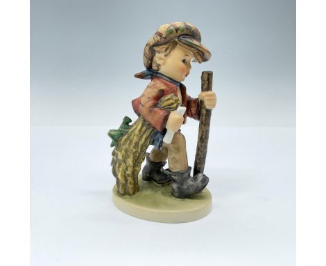 Hand painted in matte finish modeled as a young boy walking on a path with a walking stick. Goebel TMK5. Issued: 1972-1979Dim