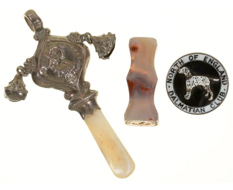 A MOTHER OF PEARL HANDLED SILVER RATTLE, SILVER AND ENAMEL BADGE AND AGATE SEAL 