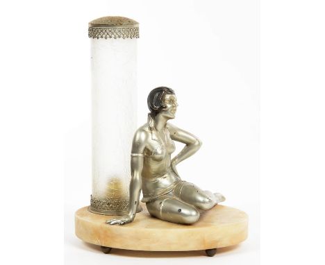 AN ART DECO SILVERED AND BRONZED SPELTER FIGURAL LAMP IN THE FORM OF A YOUNG WOMAN IN BIKINI, SEATED ON OVAL ALABASTER BASE B