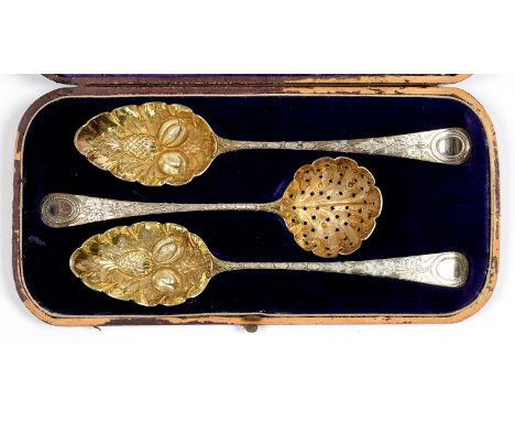 TWO GEORGE III SILVER TABLE SPOONS AND A SAUCE LADLE, LATER CHASED AND GILT AS A FRUIT SERVING SET, LONDON, VARIOUS MAKER'S A