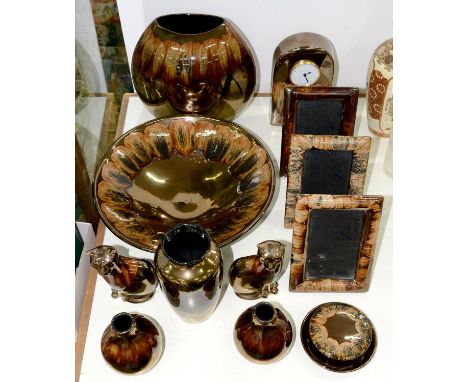 A COLLECTION OF POOLE POTTERY COPPER LUSTRE WARE, TO INCLUDE VASES, BOWLS, PAIR OF CATS, CLOCK CASE AND THREE PHOTOGRAPH FRAM