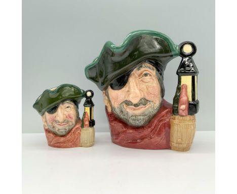 A pair of jugs depicting a man wearing an eye patch, a red scarf, and a black hat with green trim holds along with a handle t