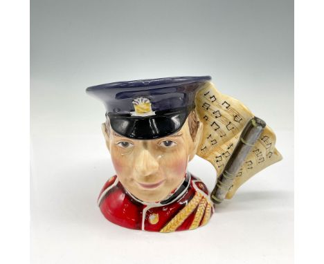 The North Staffordshire Player colored in Red and yellow braided uniform with royal blue cap and musical note handle was one 