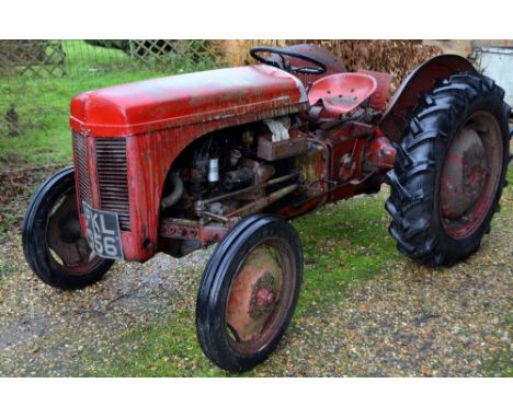 An old Ferguson red tractor, registration number PKL 956, circa 1950 , the tractor is not road worthy, no paperwork, together