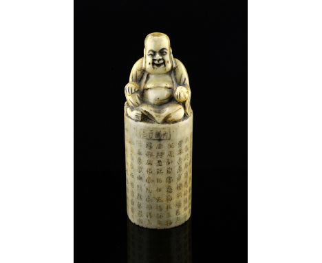 Chinese green soapstone seal with numerous calligraphy and a landscape with Buddha surmount, 14.5cm high,