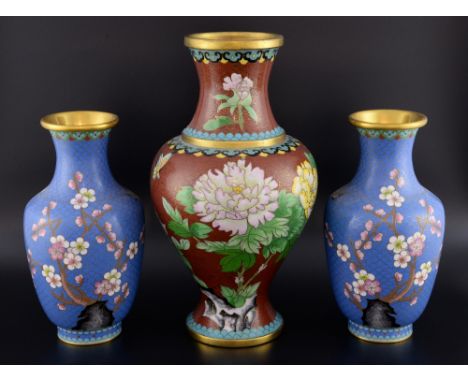 Pair of 20th century Chinese cloisonne vases, the blue ground decorated with a bird and prunus blossoms, 24cm high, and a bro