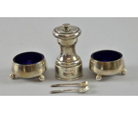 Edward VII silver pepper grinder, by Hukin & Heath, Birmingham, 1907, and a pair of silver salts on ball feet with non-matchi