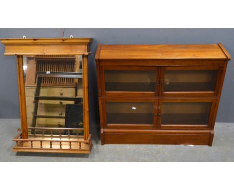 Mahogany glass fronted bookcase and a wall mirror with galleried shelf,