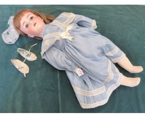 German bisque headed doll marked for Heinrich Handwerck, Simon & Halbig, No 4, with weighted blue eyes, open mouth with a blu