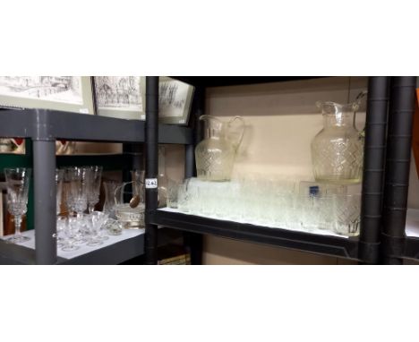 A good lot of vintage matching drinking glasses including 2 water jugs and another good shelf of glasses etc COLLECT ONLY 