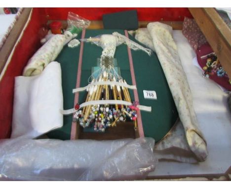 A Newham block pillow, 18 pairs of spangled lace bobbins, pin cushion, linen thread, pillow bag and matching bobbin case