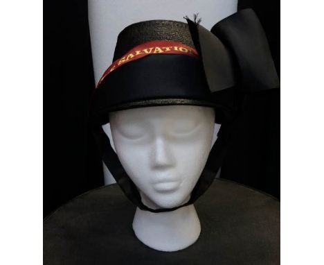 A vintage Salvation Army hat with sash and bow detail