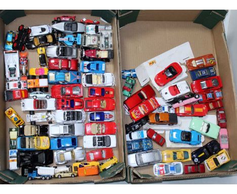 Two trays containing a quantity of mixed modern release diecasts to include a Bburago Majorette, Vintage Hotwheels, Corgi Roc