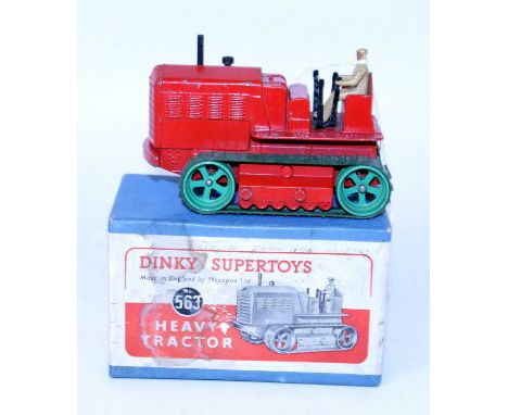 A Dinky Toys No. 563 heavy tractor comprising of red body with green wheels and green tracks, complete with driver figure, ho