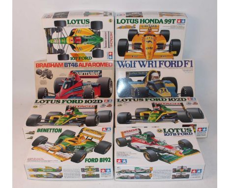 Eight various boxed Tamiya 1/20 scale Formula One related plastic race car kits to include a Lotus Ford 102D, a Lotus Ford 10