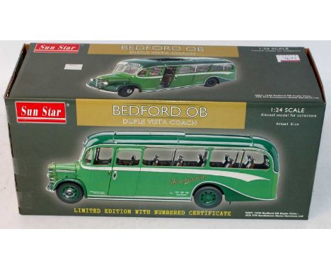 A Sunstar 1/24 scale diecast model of a Bedford OB Duple Vista coach finished in green, housed in the original card box with 