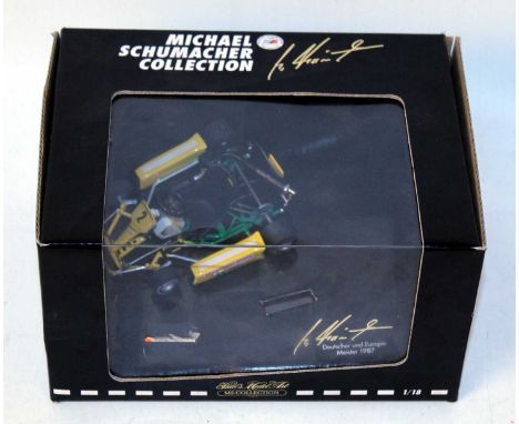 A Minichamps 1/18 scale  Michael Schumacher collection Go-kart comprising of yellow and green body housed in the original win
