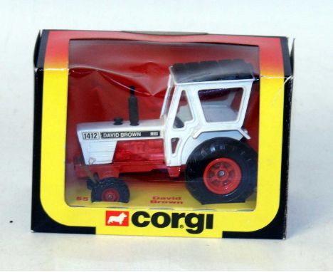 A Corgi Toys No. 55 David Brown tractor comprising of black, white and red body, housed in the original orange, yellow and bl