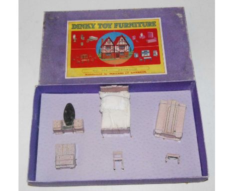 Dinky Toys Pre War No.102 Bedroom set in box, Consists of bed, wardrobe, dressing table, cupboard, chair and foot stool. All 