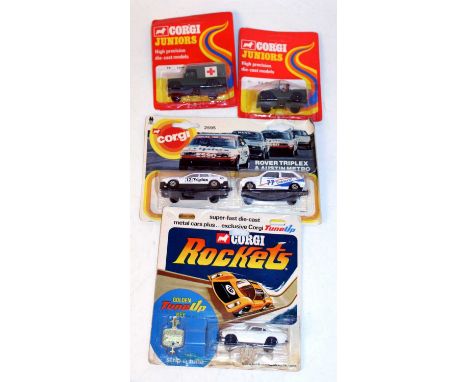 A Corgi Juniors and Corgi Rockets carded diecast group to include No. 76 US Military Jeep, No. 79 Land Rover Military Ambulan