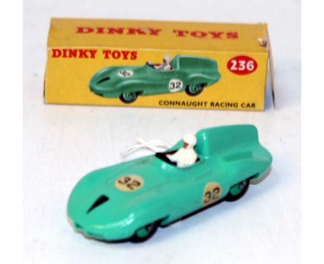 A Dinky Toys No. 236 Connaught Racing car comprising of light green body with green hubs, racing driver figure, and racing No