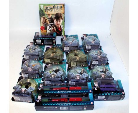 One box containing a quantity of various carded Harry Potter Collectable action figures and related accessories, to include a