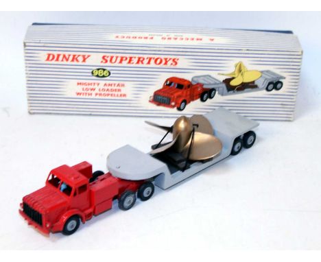A Dinky Toys No. 986 Mighty Antar low loader with propeller, comprising of red tractor unit with grey low loader trailer and 