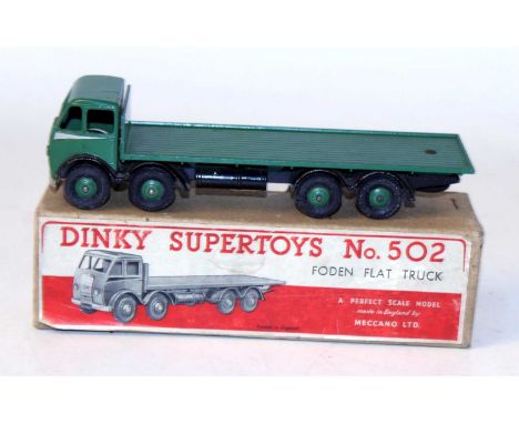 A Dinky Toys No. 502 Foden flat truck, comprising of first type green cab, and back with black chassis and matching green Sup