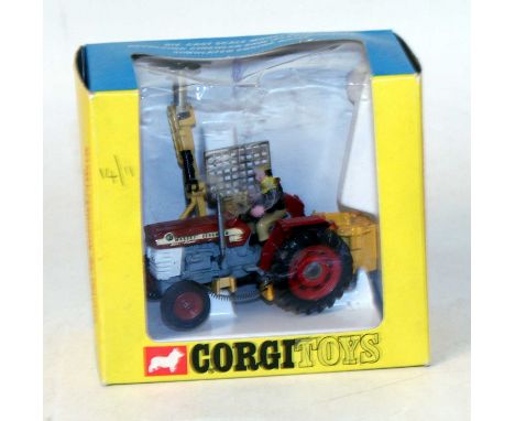 A Corgi Toys No. 73 Massey Ferguson 165 tractor with saw attachment, housed in the original window box (model slightly playwo